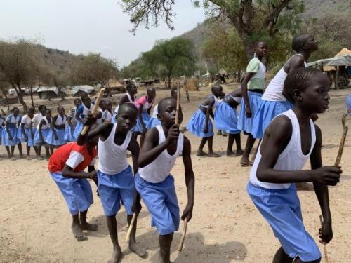 Children in Uganda dance and play.